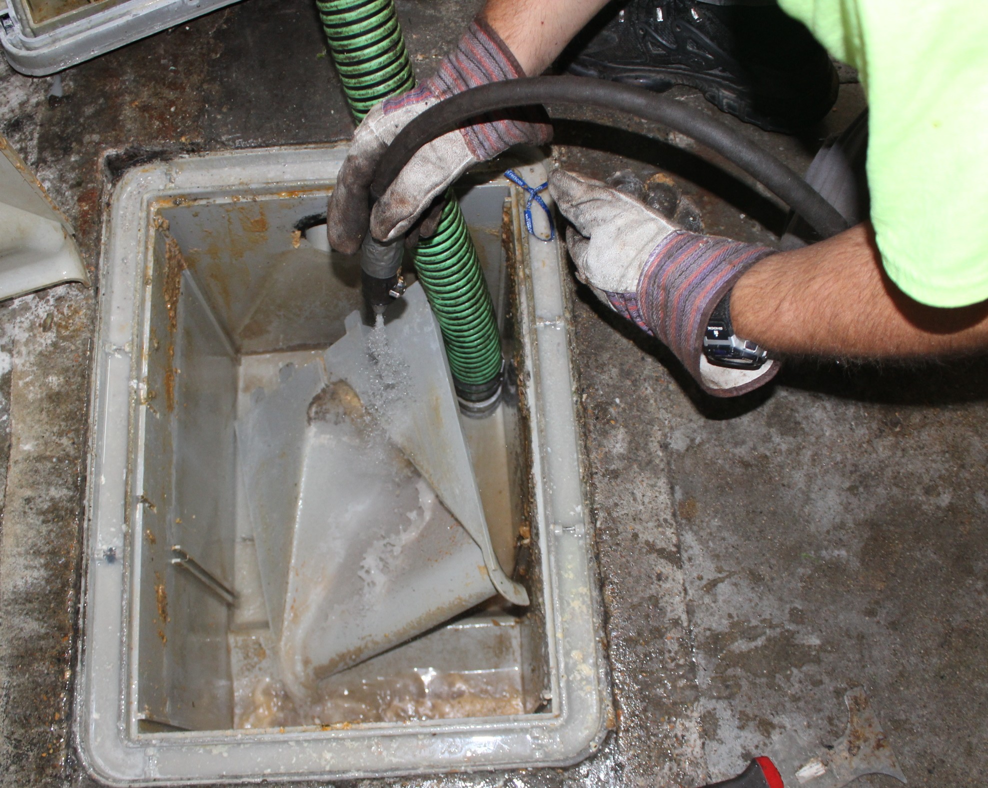 Engineer inspecting an industrial pipeline for grease buildup
